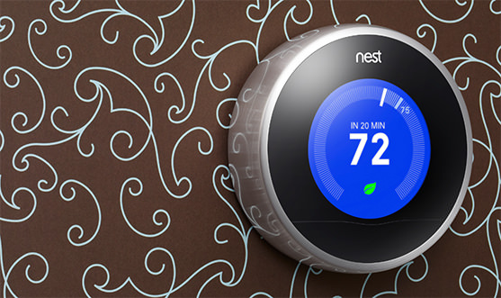 Next generation Nest showing off cahameleon design against wallpaper