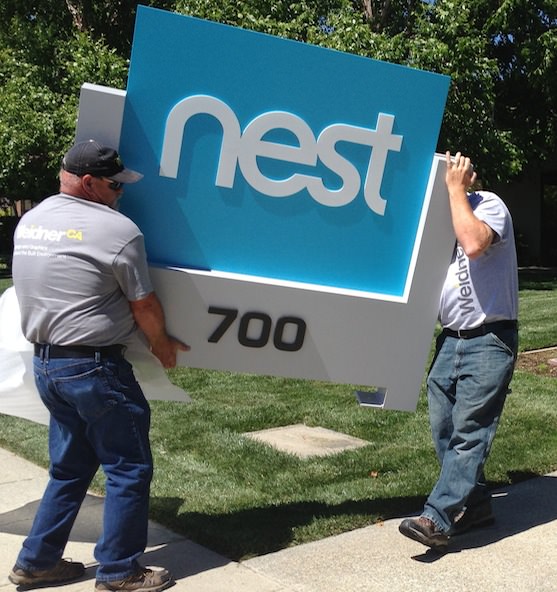 Nest sign being installed.